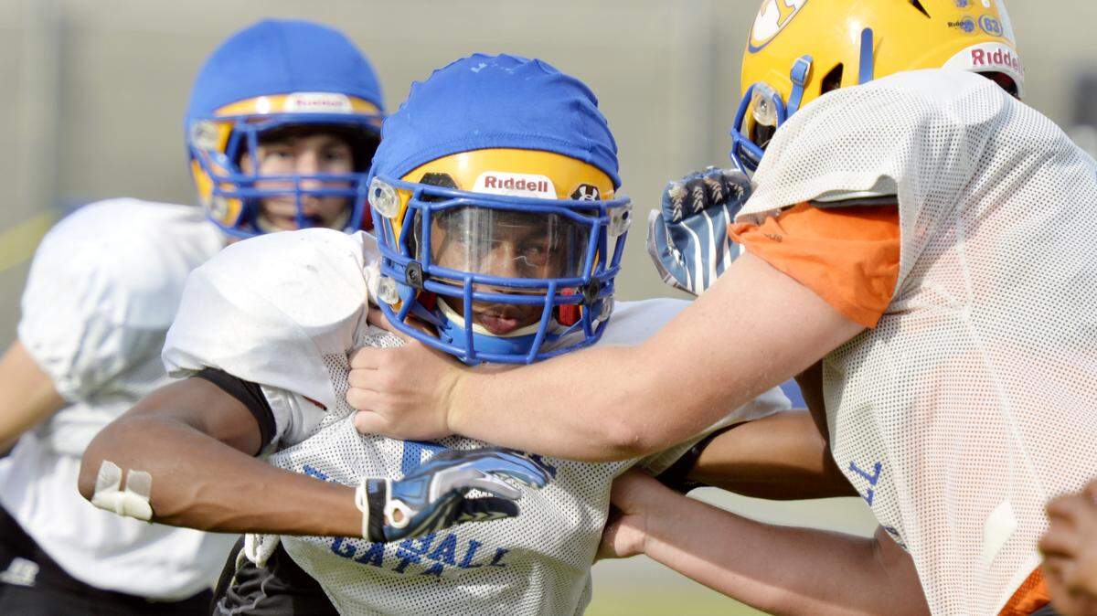 JASON VORHEES/THE TELEGRAPHTattnall Square’s Vasco Sanders, left, attempts to get off a block during practice Tuesday afternoon.
