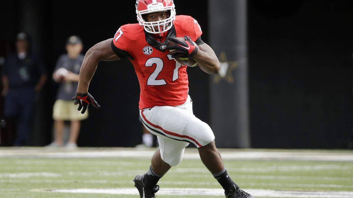 Georgia running back Nick Chubb carries the ball against Vanderbilt in the first half of an NCAA college football game Saturday, Sept. 12, 2015, in Nashville, Tenn. Chubb ran for 189 yards as Georgia won 31-14. (AP Photo/Mark Humphrey)