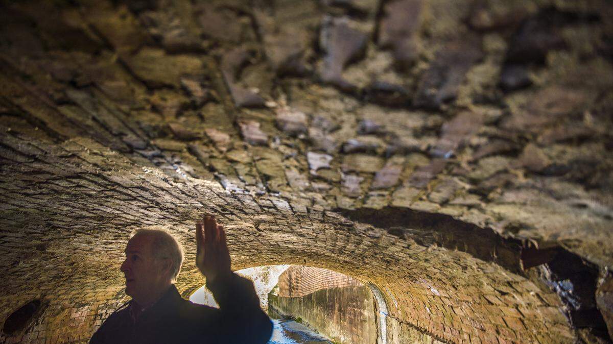 Clay Murphey, program director for special sales tax funded projects in Macon-Bibb County, points out how the stormwater culvert running underneath Second Street and Hazel Street in Macon is in danger of falling in. Murphey wants $30 million on top of the $14 million he has already been given for addressing the problem across downtown Macon.