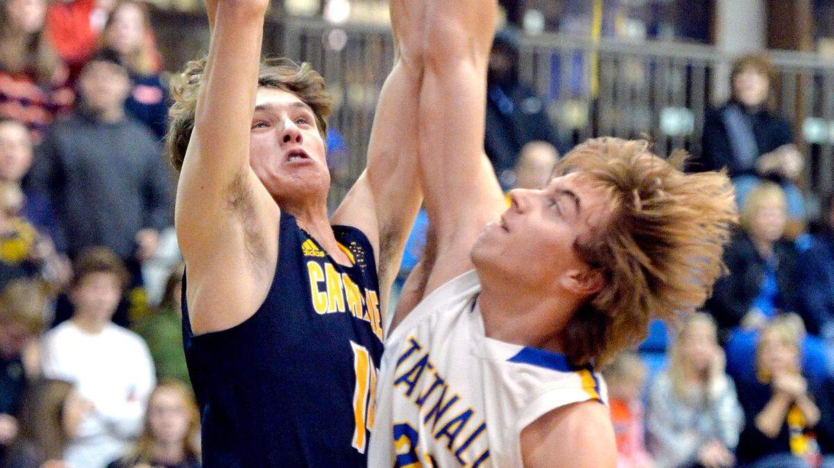 Mount de Sales' Adam Leverett (14) is fouled by Tattnall's Noah Malone during their game Friday night.
