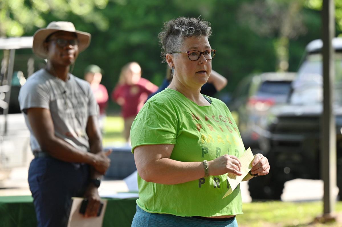 Southern Queer Folk Hikes founder Pam Pinkston speaks to attendees before the start of the Pride in Our Parks event on Saturday, June 8, 2024, at Ocmulgee Mounds National Historical Park in Macon, Georgia. Southern Queer Folk Hikes partnered with Macon Pride and Ocmulgee Mounds National Historical Park for the event to work on two citizen science projects assisting in park maintenance.