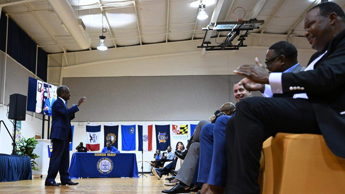 Attendeees applaud former Dekalb County CEO Mike Thurmond during his remarks at the “Meet & Greet Your Next Governor of Georgia” panel on Wednesday, Aug. 20, 2025, at the First Baptist Church New Beginnings Center in Warner Robins, Georgia. Nine candidates for Georgia governor spoke on their platforms in person and virtually ahead of the 2026 election at the event hosted by the Houston and Bibb NAACP chapters. 