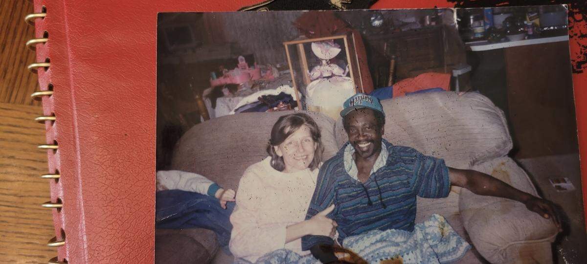 Barbara Crenshaw held the arm of her boyfriend, known as JD, as they smiled on a couch together in 1995. Crenshaw’s great-niece poked her arm as they posed for a photo. Crenshaw was the victim of an alleged homicide in 1996 that was still unsolved by September 2025.