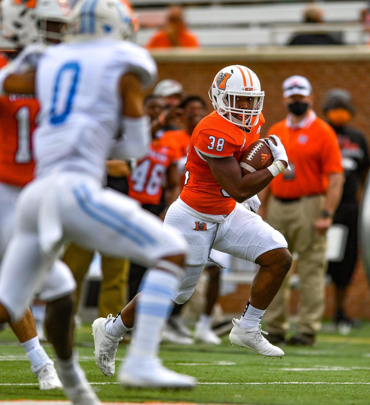 DONN RODENROTH,Macon, Georgia, 02/27/2021: Mercer running back Julian Beris swing around the end on his way to first down Saturday against The Citadel. Mercer defeated The Citadel 42-28.