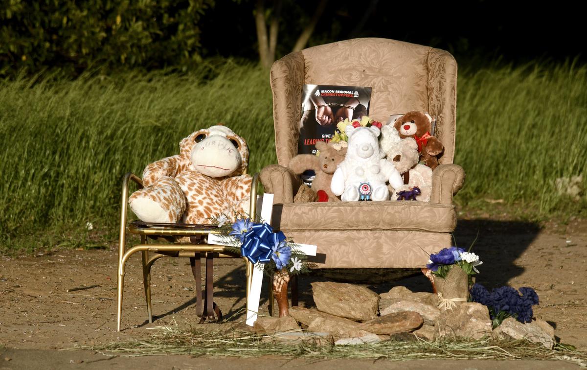 A memorial for Marlon Jermaine "Bobo" Williams, 44, is placed along Mason Street in Macon. Williams was caught in a spray of bullets and killed in the early hours of April 14.