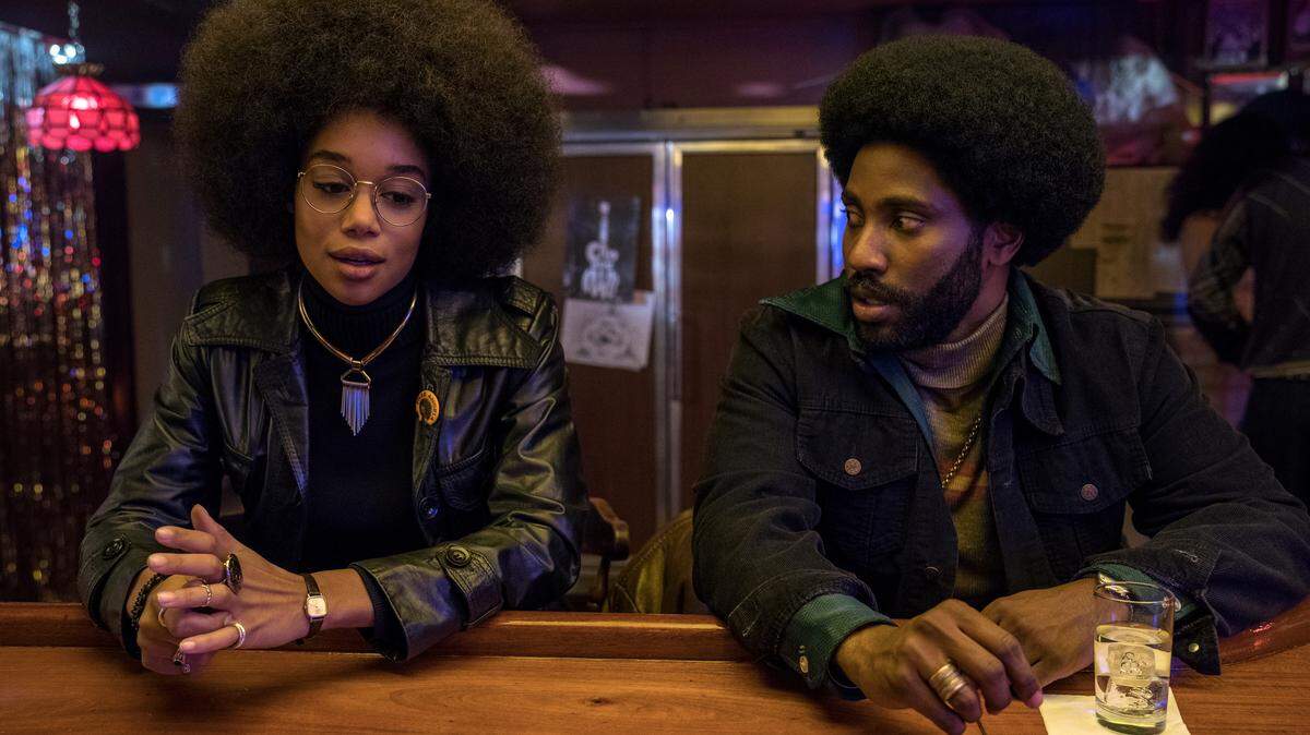 Laura Harrier stars as Patrice and John David Washington as Ron Stallworth in Spike Lee’s “BlacKkKlansman.”