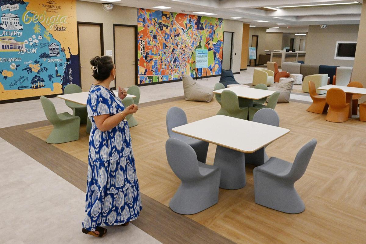 River Edge Chief IDD Officer Greta O’Dell looks over the living and dining room while giving a tour of the River Edge Crisis Services and Diagnostic Center on Thursday, June 5, 2025, in Macon, Georgia.