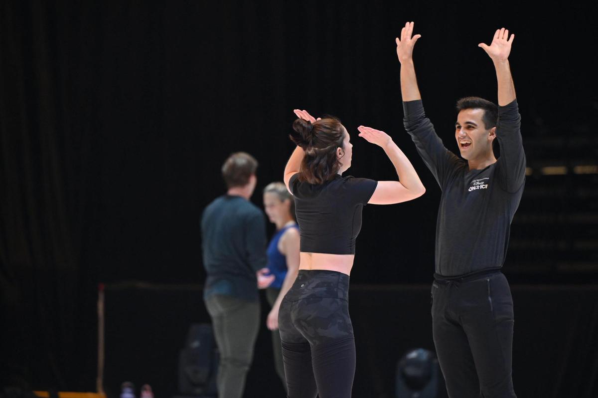 Disney on Ice skaters Taylor Steele (left) and Gaiska Madejon Cambra high five during rehearsal for “Into the Magic” Disney on Ice tour on Friday, Nov. 1, 2024, at the Macon Coliseum in Macon, Georgia. The world tour will start its run in Macon on Friday night, with shows throughout the weekend.