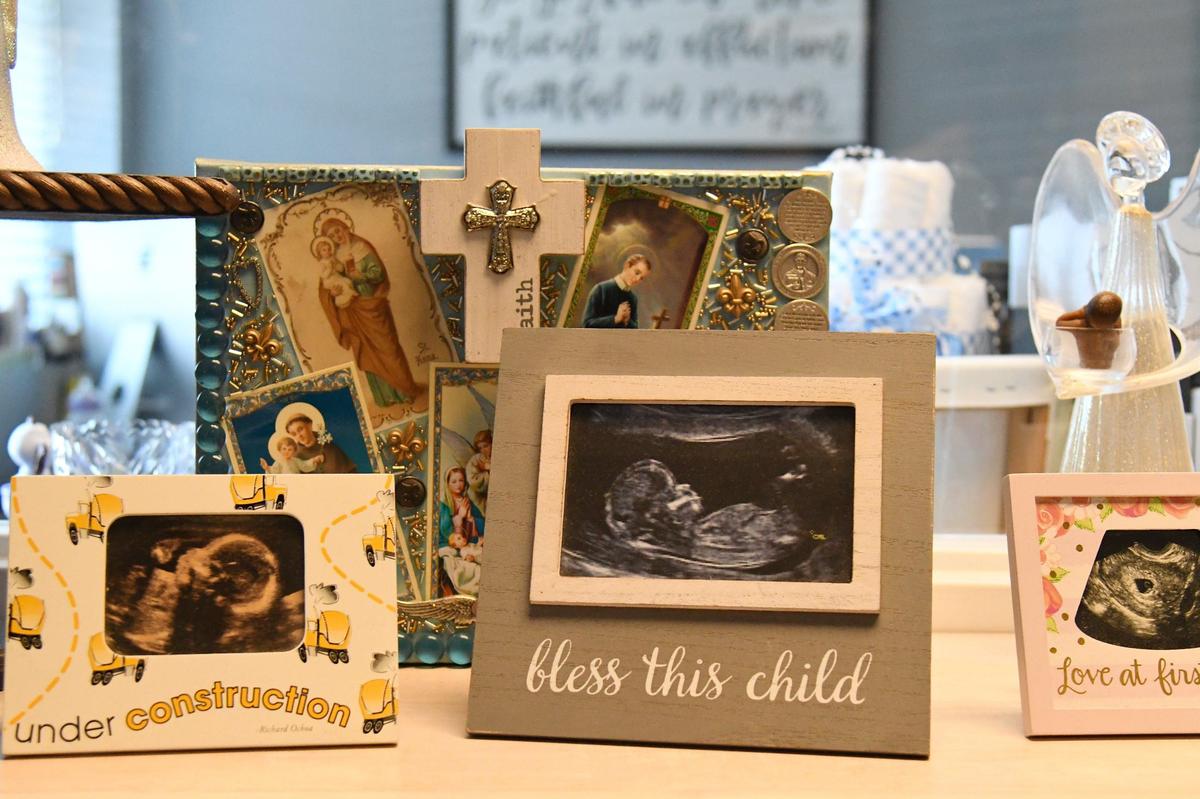 Several ultrasound photos sit outside of Kolbe Center executive director Ann Beall’s office on Thursday, June 13, 2024, at the Kolbe Center in Macon, Georgia. The Kolbe Center is a pregnancy resource center in Macon, but will not perform or consult pregnant women to get abortions.