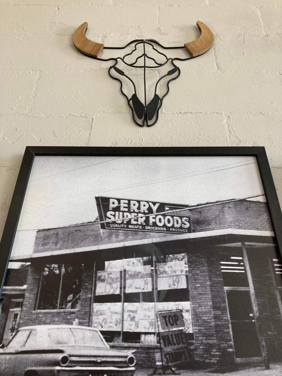 A photo of Perry Super Foods hangs on the wall at Durden’s Prime Meats in downtown Perry.