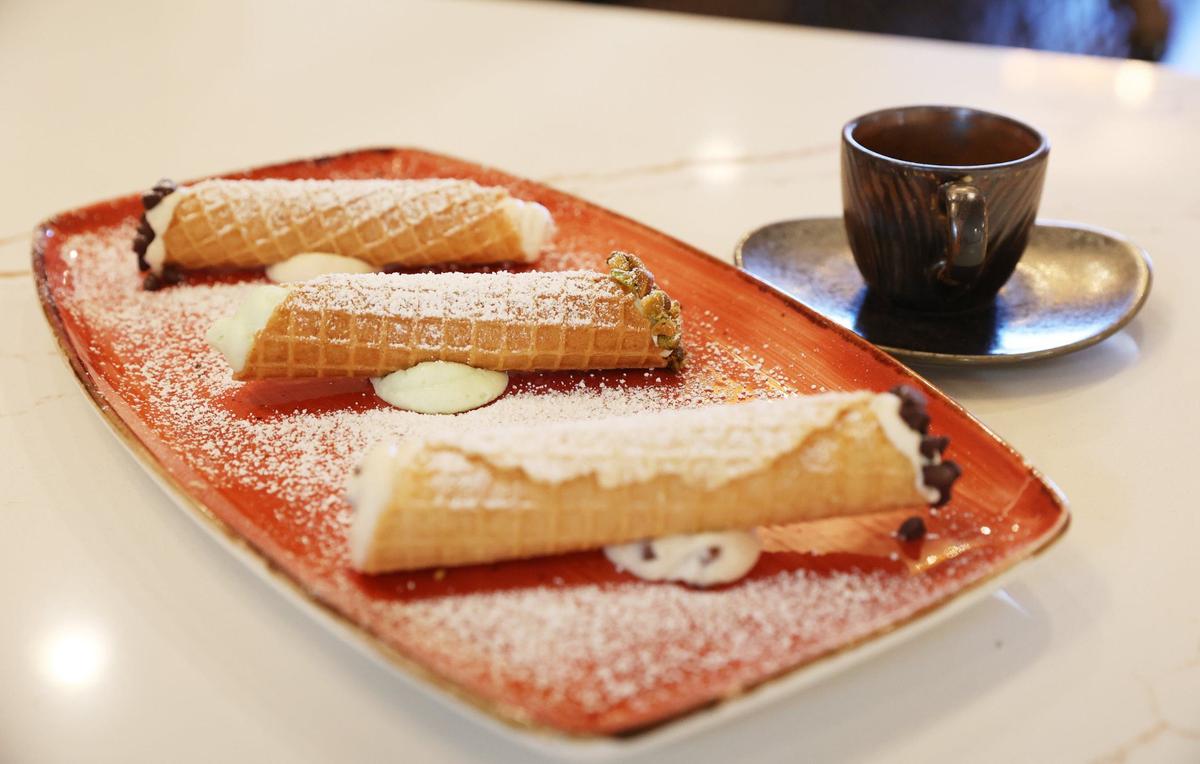 Classic, pistachio and almond cannolis sit on a plate in Trattoria di Napoli on Wednesday, Aug. 7, 2024, in downtown Perry, Georgia. Owner and operator John Staurulakis has worked in the restaurant industry for most of his life, but soon will open Trattoria di Napoli as his first restaurant.