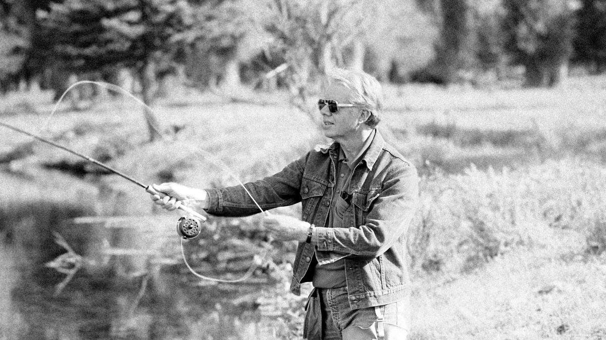 President Jimmy Carter casts a fly on Crane Creek in Jackson, Wyoming on August 28, 1978 during a morning fishing trip.