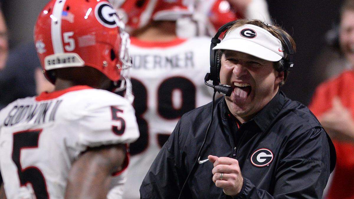 Kirby Smart goes to fist-bump Terry Godwin during the SEC Championship.