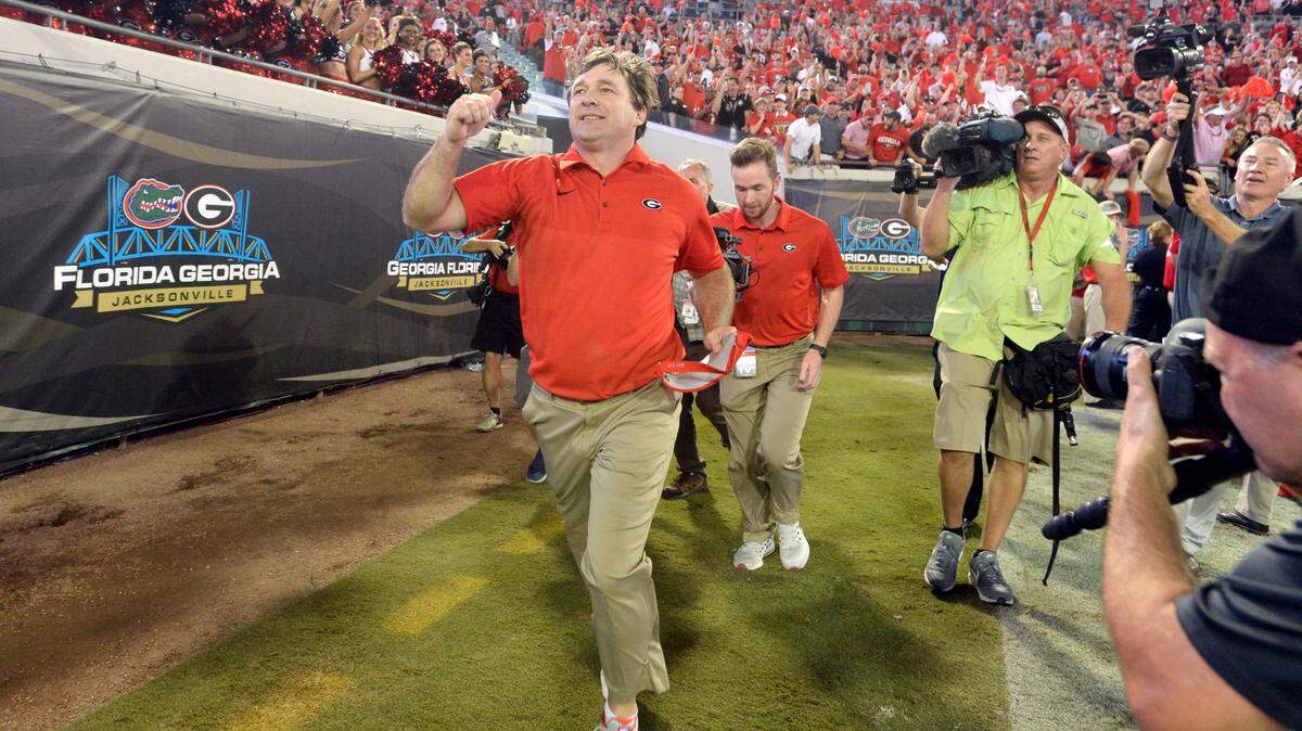 Georgia head coach Kirby Smart salutes the fans after the Bulldogs' 42-7 win over Florida during the 2017 season.