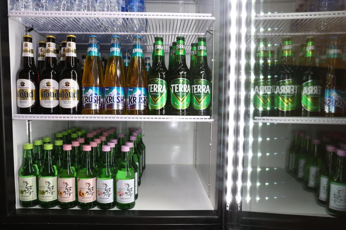 Korean beer and soju sit inside of a fridge at Gangnam Grille on Tuesday, Jan. 14, 2025, in downtown Macon, Ga. The new casual, fast paced Korean restaurant sits in the space where Ninja Steakhouse and Sushi used to be, but with the same ownership.