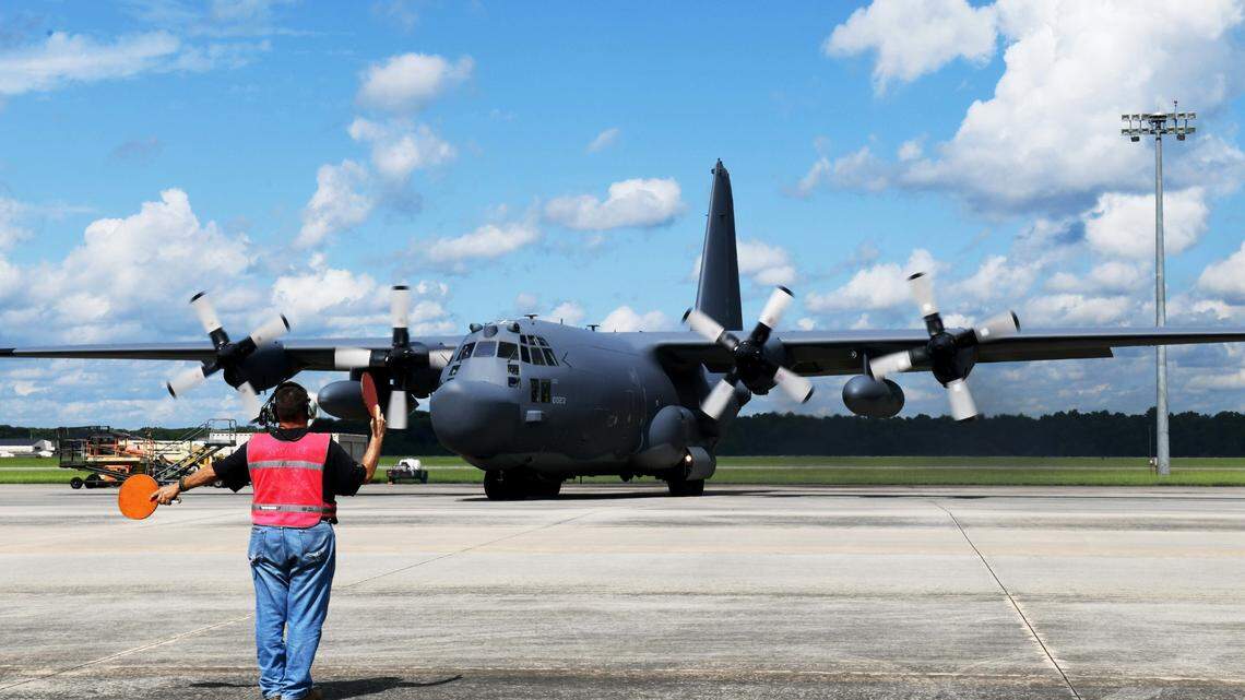 Dean Huber, 560th Aircraft Maintenance Squadron functional aircraft mechanic, marshals an MC-130H Combat Talon II aircraft to the taxi-way at Robins Air Force Base, Georgia, Aug. 20, 2021. This was the final MC-130H aircraft to undergo programmed depot maintenance at Robins AFB before going back to its home station at Hurlburt Field, Florida.