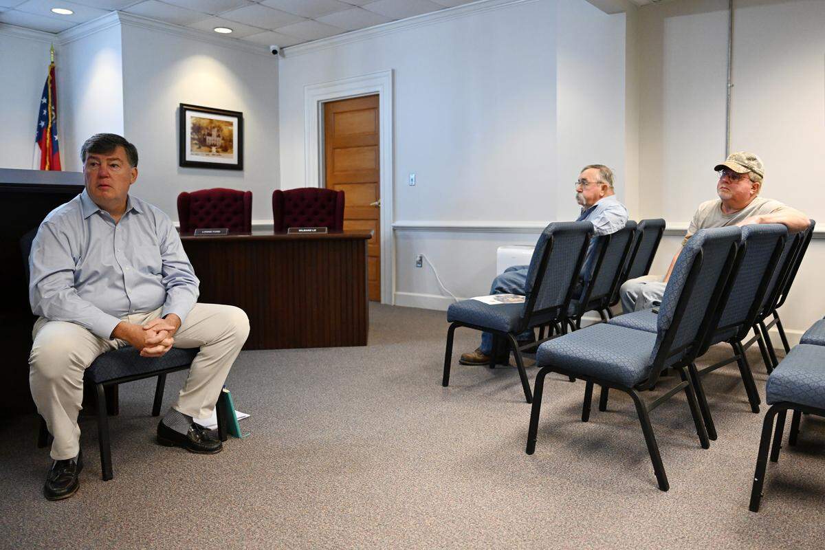 Eagle Rock Partners founding partner Ken Loeber (left) speaks to Twiggs County residents in the first of five public question and answer sessions on Tuesday, Sept. 16, 2025, inside of the Twiggs County courthouse. Charlotte based Eagle Rock Partners is the project developer for the proposed Twiggs County data center, which would consist of nine buildings and three substations. 