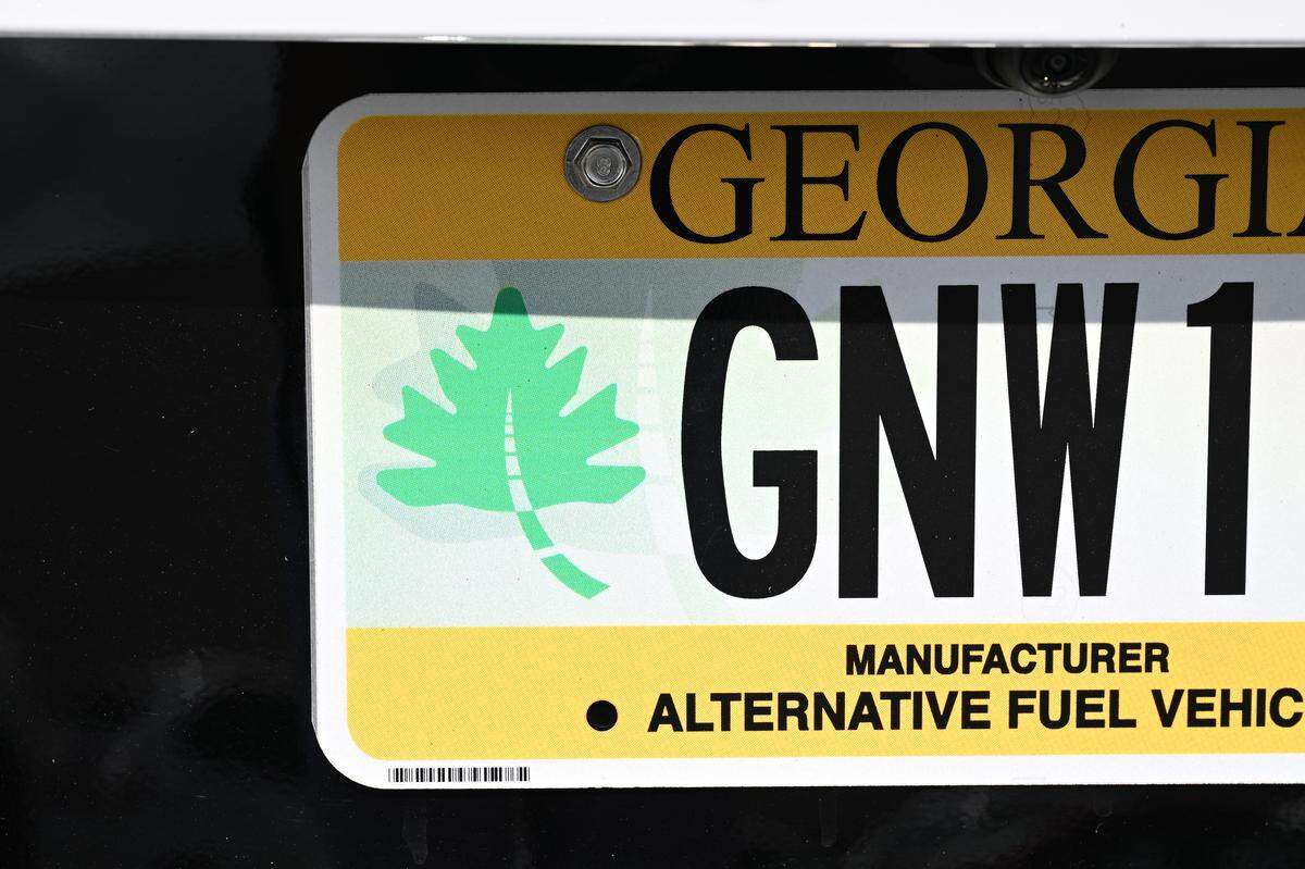 A license plate sits on a demo alternative fuel vehicle in the parking lot at the Clean Energy Roadshow on Wednesday, Aug. 13, 2025, outside of the Middle Georgia Regional Commission in Macon, Georgia. The annual Clean Energy Roadshow, which stopped in Macon and two other Georgia cities, held seminars on and showcased alternative fuel vehicles. 