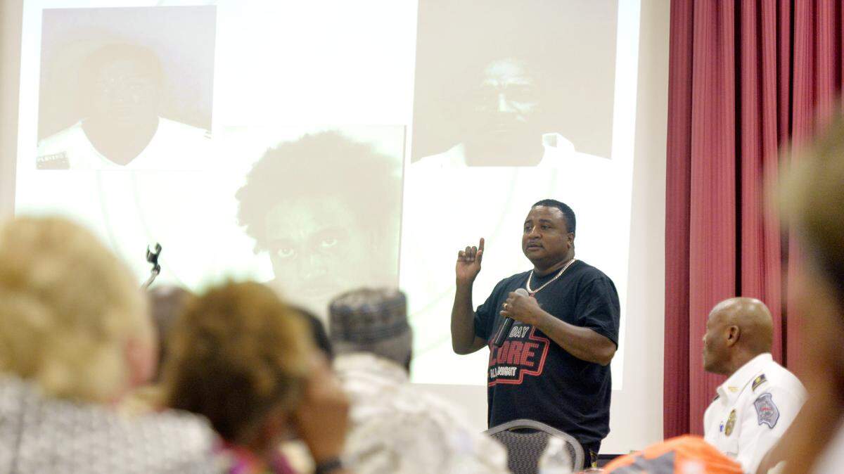 Former gang member Chris Brooks speaks during a gang violence prevention and awareness forum Tuesday night at the Wellston Center in Warner Robins.