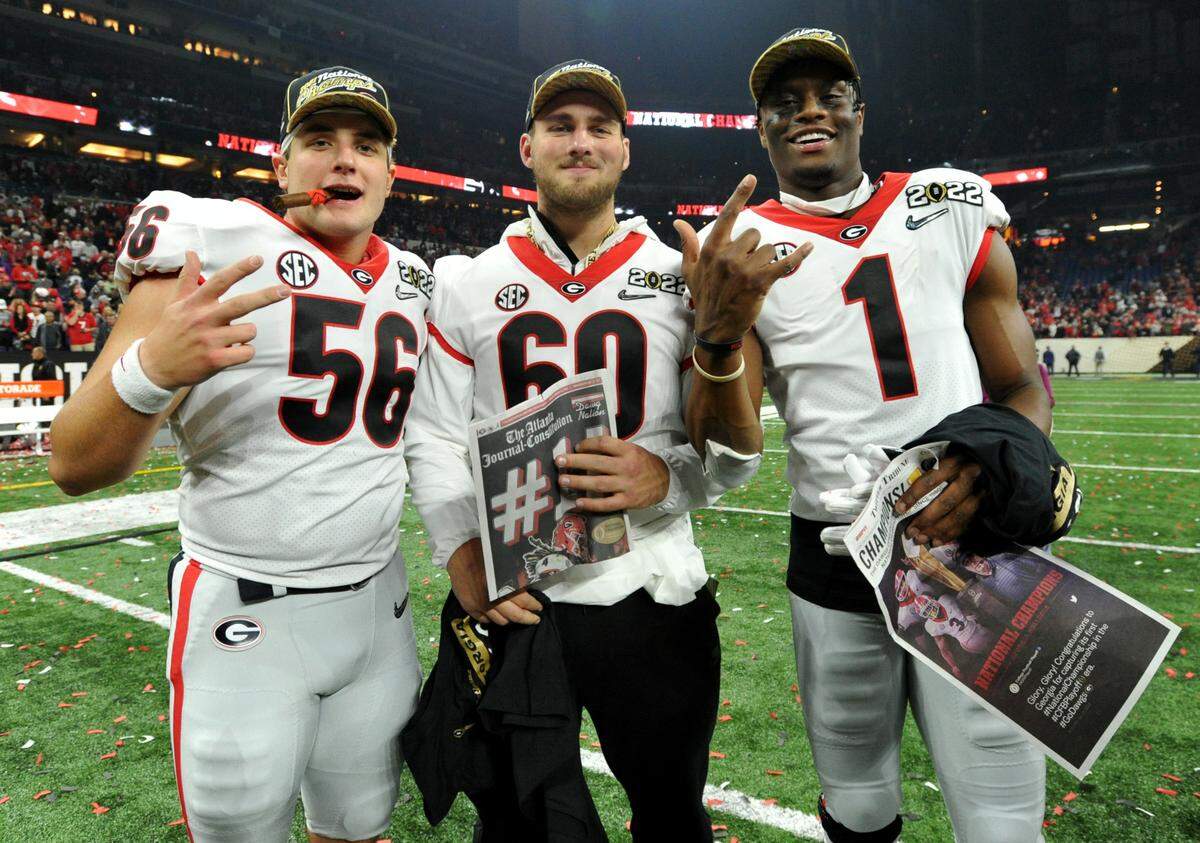 Georgia players celebrate the Bulldogs’ 33-18 win over Alabama in the College Football Playoff National Championship game Monday night.