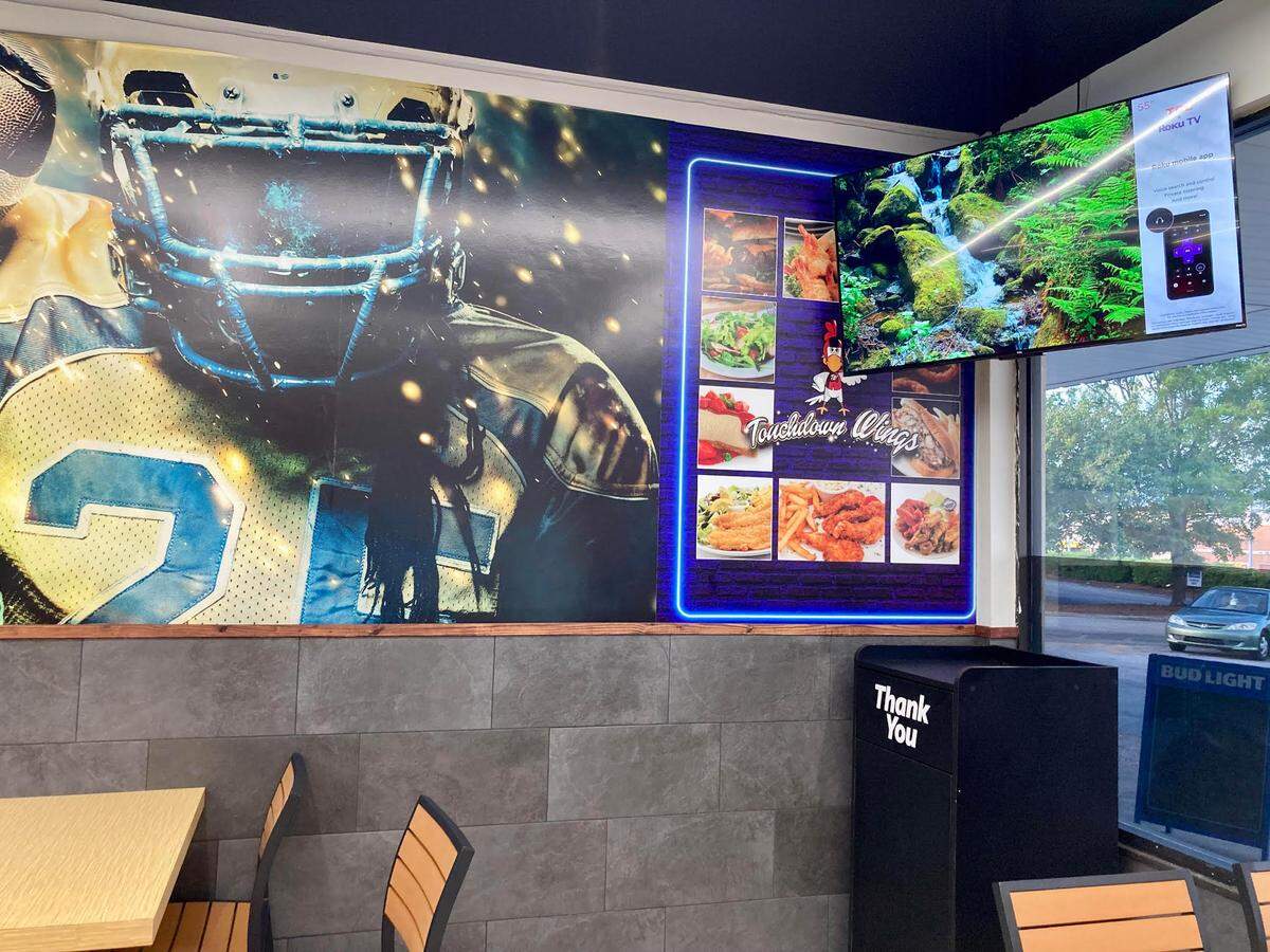 TouchDown Wings, a new restaurant in the Kroger shopping center off Russell Parkway in Warner Robins, features sports memorabilia and a large-screen TV.
