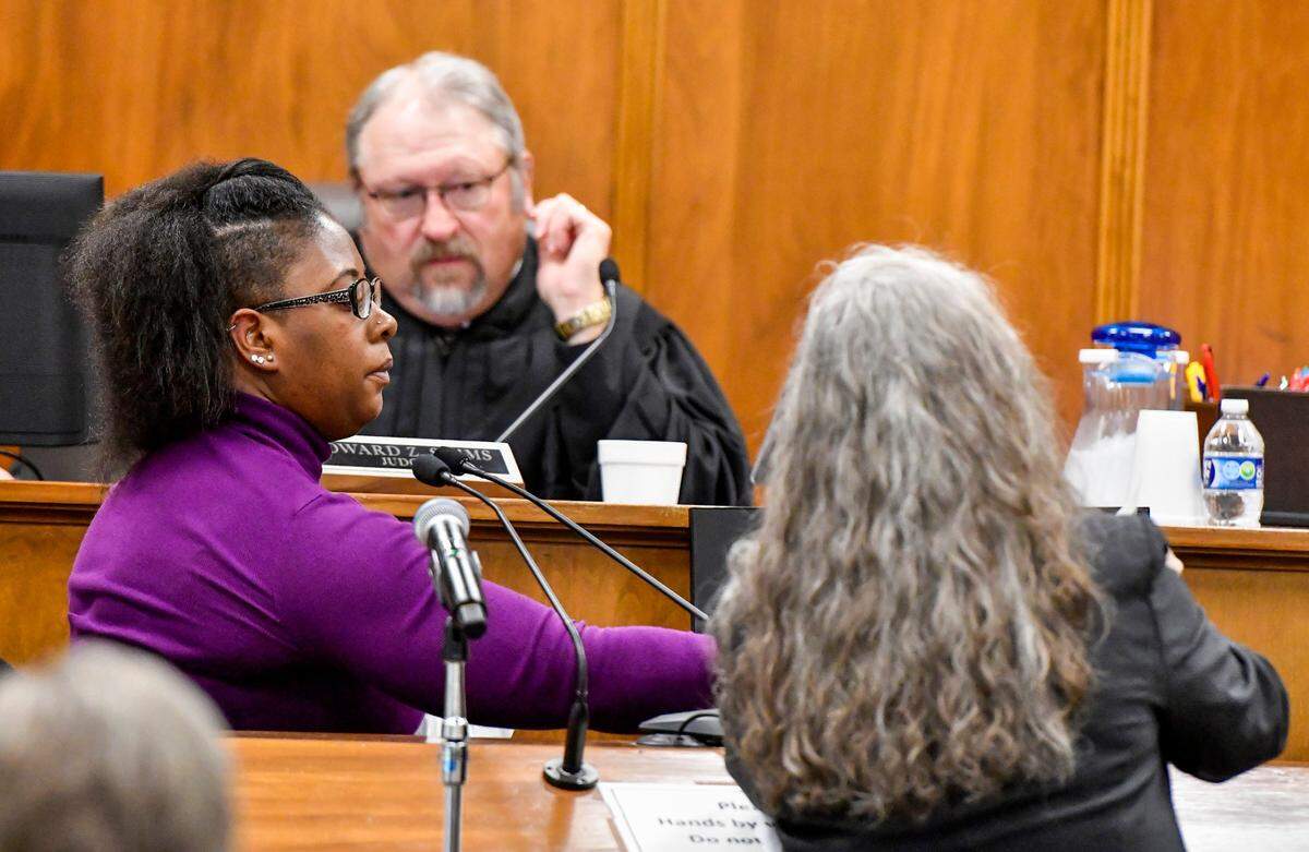 Jamila French points to an aerial map of her family’s former home while on the stand during the murder trial of her son’s father Caesar Zamien Crockett.
