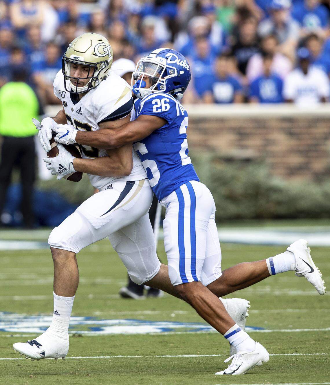 Georgia Tech’s Tyler Davis, left, is tackled by Duke’s Michael Carter II (26) during an NCAA college football game in Durham, N.C., Saturday, Oct. 12, 2019.