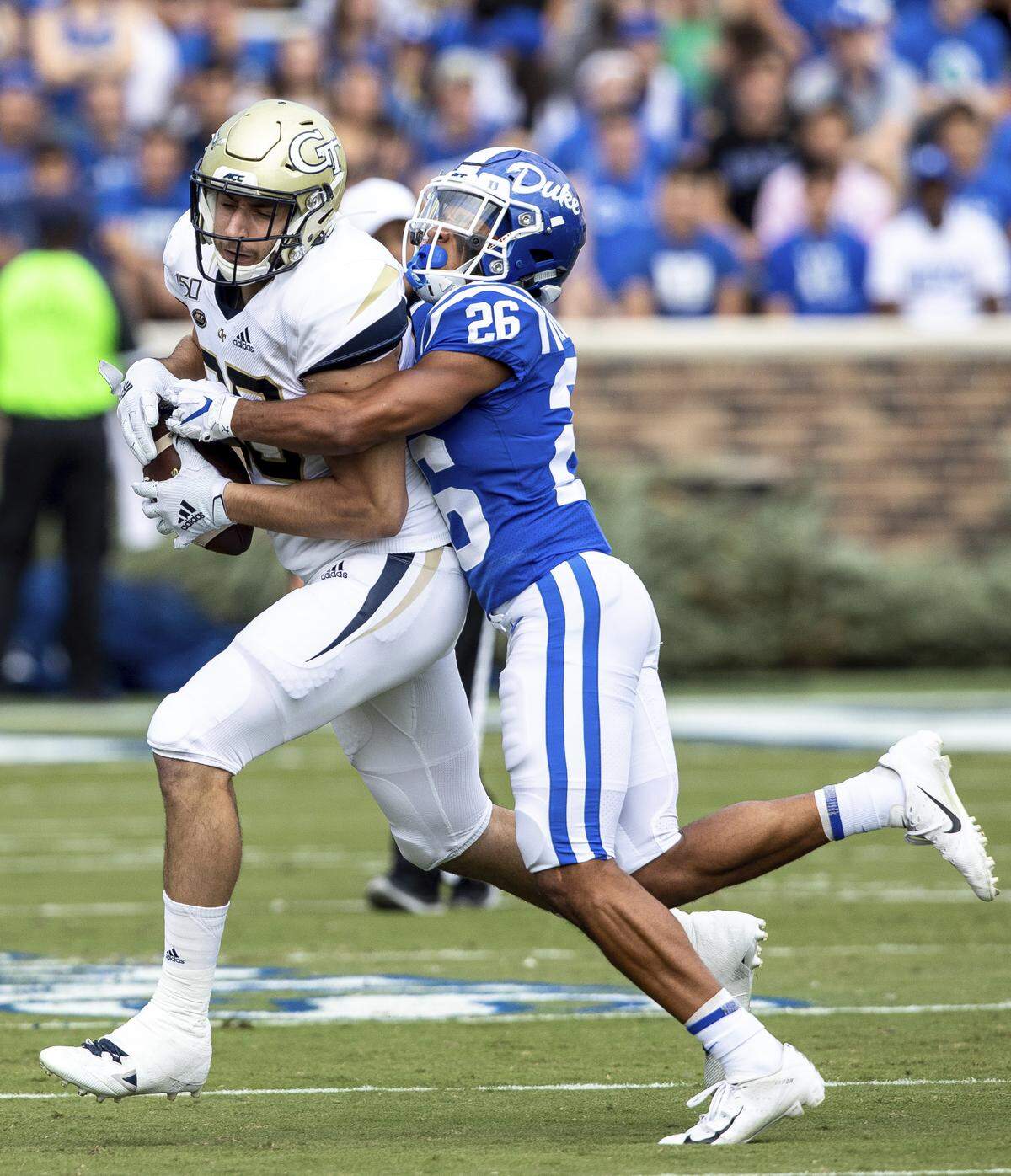 Georgia Tech’s Tyler Davis, left, is tackled by Duke’s Michael Carter II (26) during an NCAA college football game in Durham, N.C., Saturday, Oct. 12, 2019.
