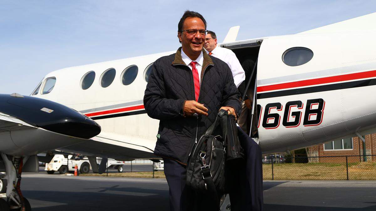 Tom Crean is photographed after landing in Athens on Georgia's team plane.