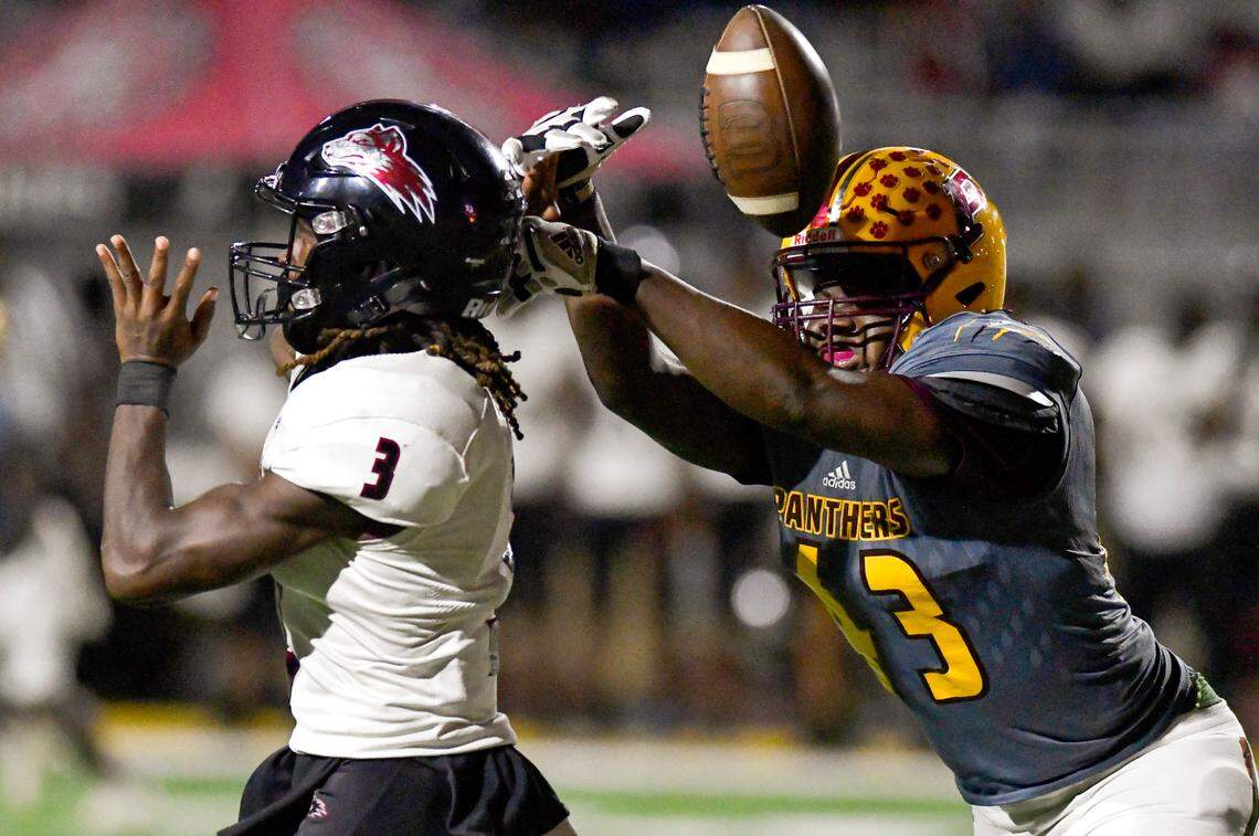 Perry linebacker Ashlon Ashley (43) strip the ball away from Howard quarterback Camareon Taylor (3) during their game Friday night.