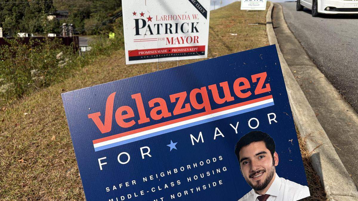 Campaign signs for Warner Robins mayoral candidates along the roadway leading to the Houston Health Pavilion Conference Center at 233 North Houston Road in Warner Robins, an early voting place.