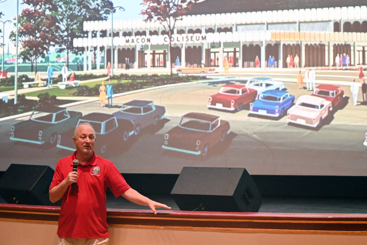 Macon-Bibb County mayor Lester Miller speaks to audience members while standing in front of an illustration of the original Macon Coliseum on Wednesday, June 24, 2026, at the Douglass Theatre in Macon, Ga. The city presented the designs for the new Macon arena, which is expected to have its groundbreaking next month.