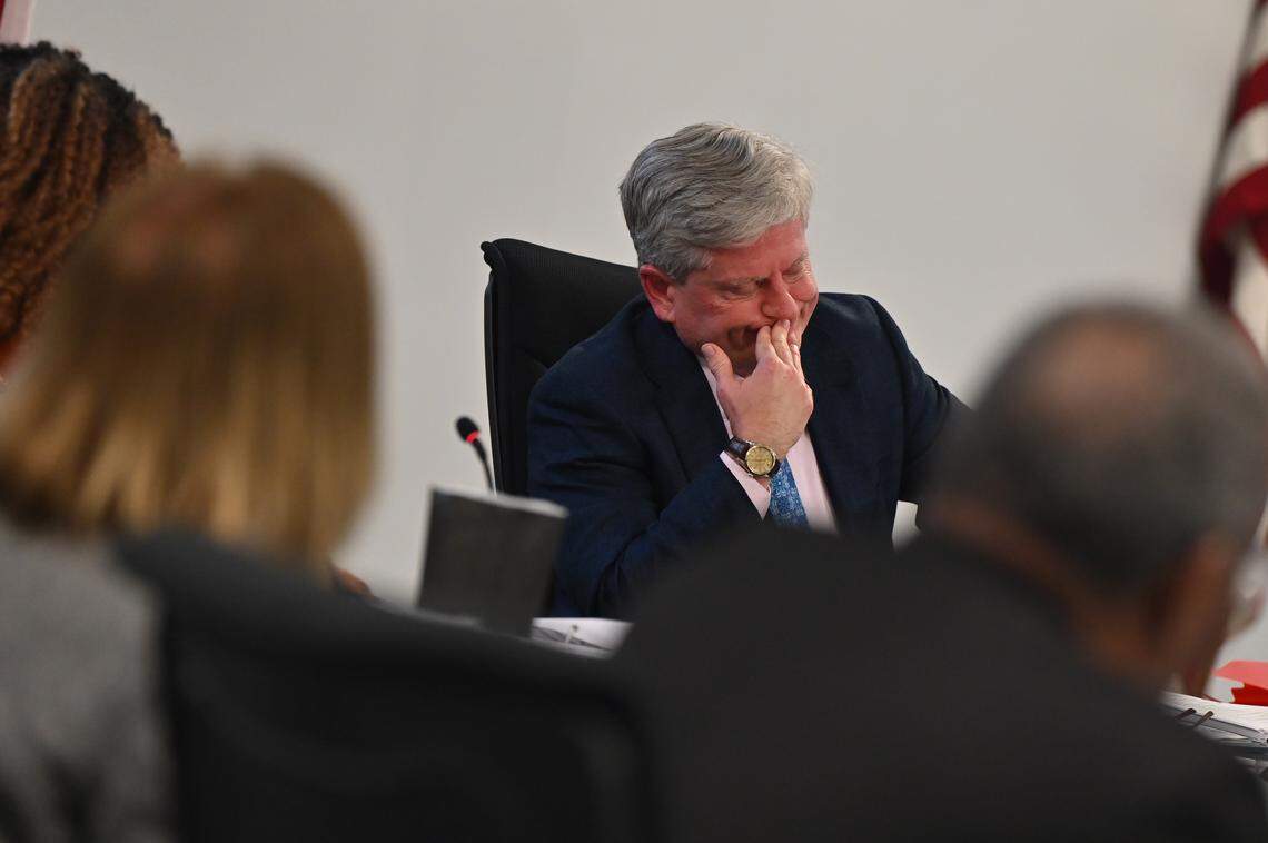Bibb County Board of Education vice president Daryl Morton reacts while voting on tabling or passing a budget amendment during the board meeting on Thursday, Jan. 15, 2026, at the Bibb County Professional Learning Center in Macon, Georgia. The board passed a proposed budget amendment at their January meeting without an unspecified $1.2 million cost reduction and will revisit the reduction next month once there are more details. 