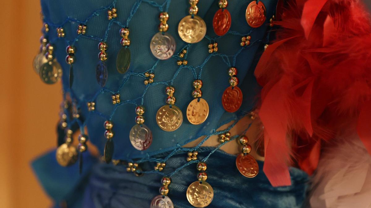 Coins and beads hang off of a costume on display at a studio in downtown Perry that offers one type of dance that’s “beautiful on everybody.” Photo taken Thursday, Aug. 29, 2024, in Perry, Georgia.