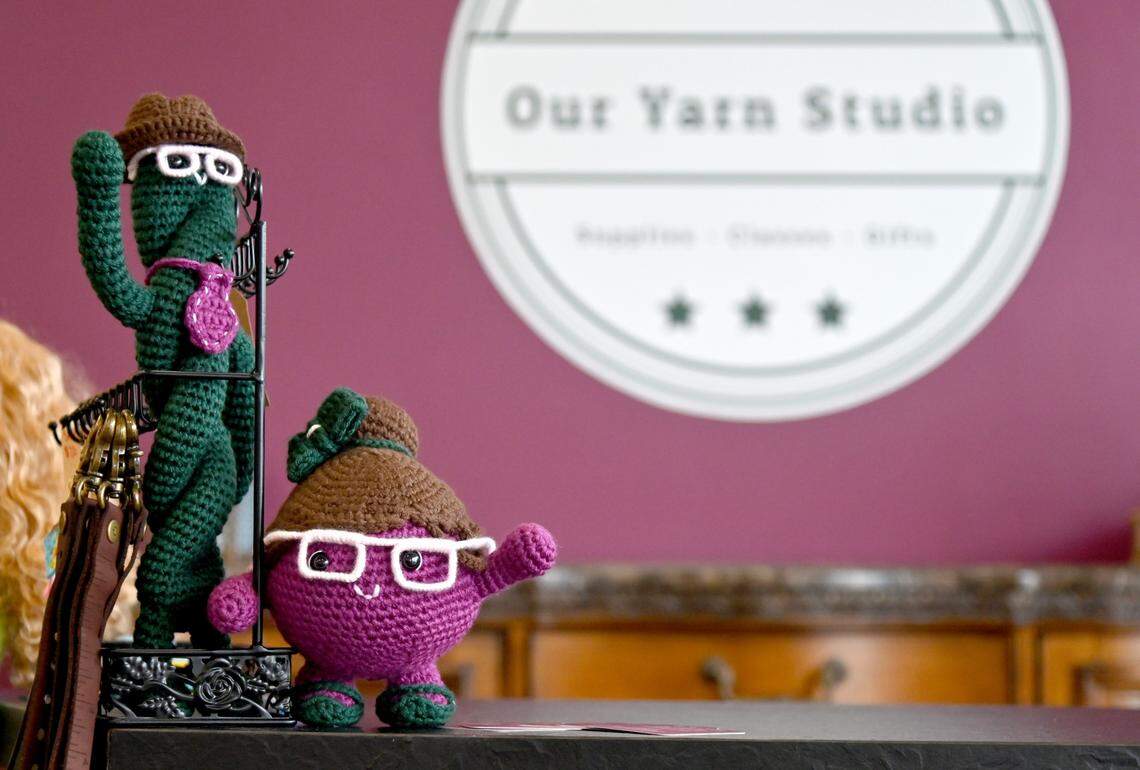 Official store mascots Hank and Pearl greet customers at checkout at Our Yarn Studio located at 4993 Russell Pkwy, Suite 350 in Warner Robins.