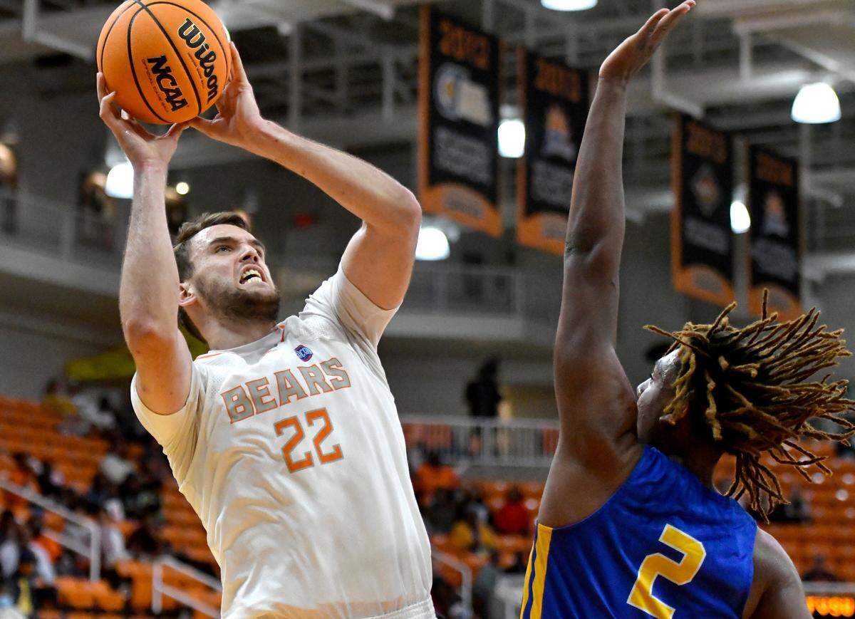 Mercer forward Felipe Haase (22) puts spa shot over Fort Valley State’s Kenneth Doucet (2) during their exhibition game Nov. 3.