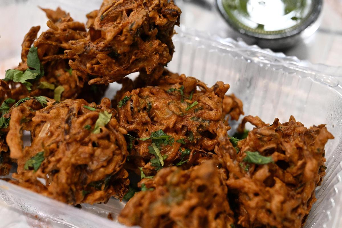 Mixed pakora from Cook-in-Pot sits in a to-go box inside of the restaurant on Tuesday, June 3, 2025, in Macon, Georgia. The Indian fritter dish is served as an appetizer at Cook-in-Pot and features fried mixed vegetables and spices.