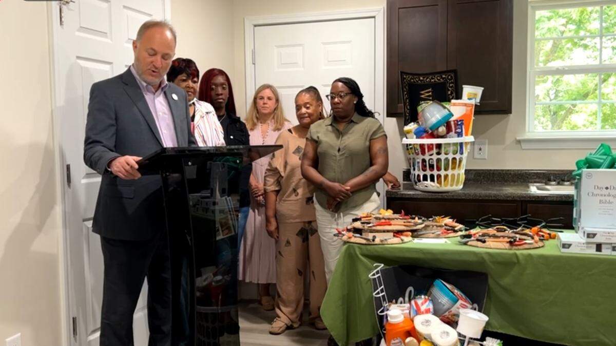 Mayor Lester Miller speaks at a Macon Area Habitat for Humanity home dedication on Thursday. Two of the four homes dedicated were built on blight property.