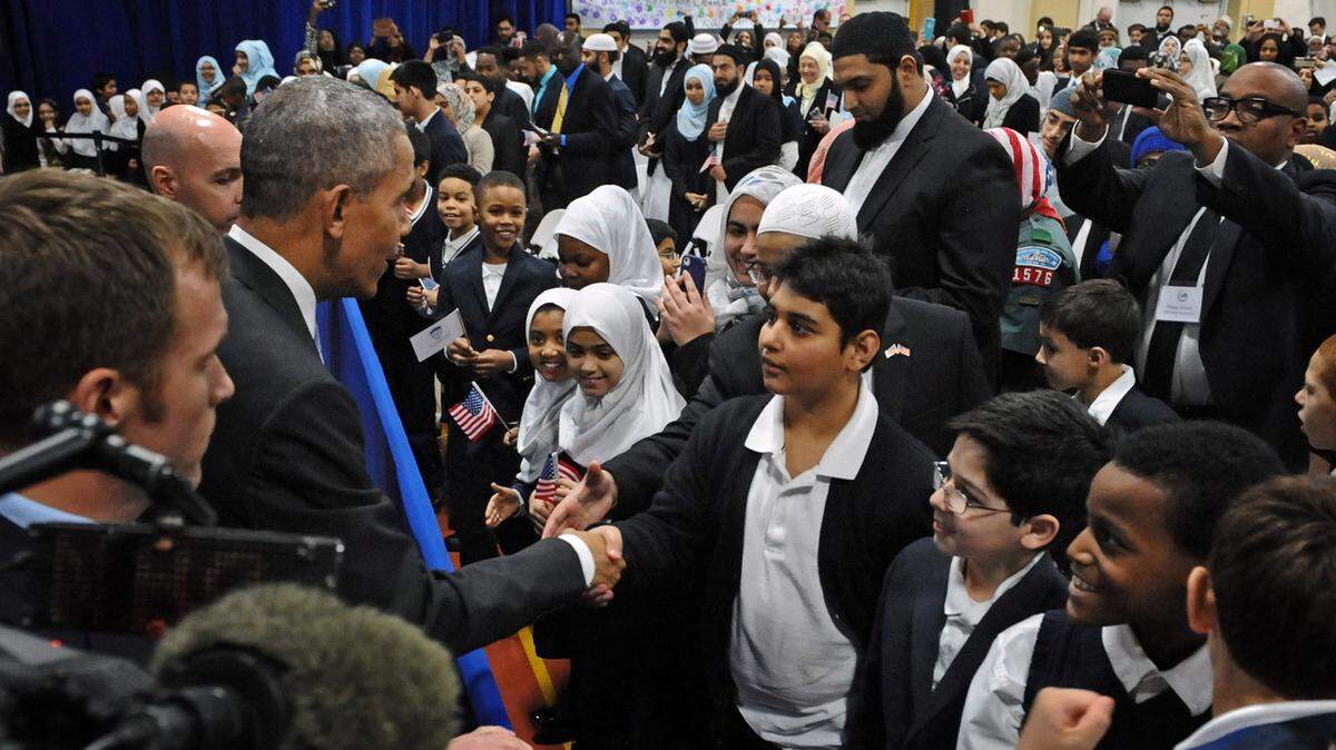 KENNETH K. LAM/BALTIMORE SUNPresident Barack Obama shakes hands with students of the Al-Rahmah School during his visit to the Islamic Society of Baltimore on Feb. 3.