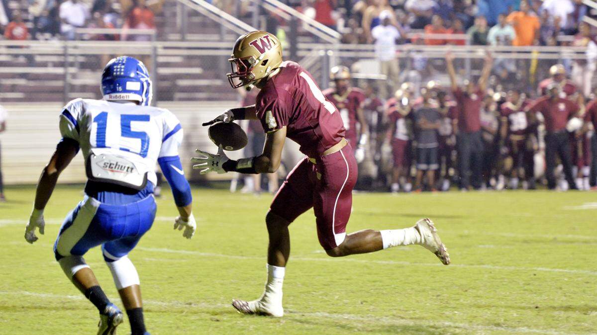 Westside receiver Steve Dolphus (4) crosses into the end zone for a touchdown during their game against West Laurens Friday night.