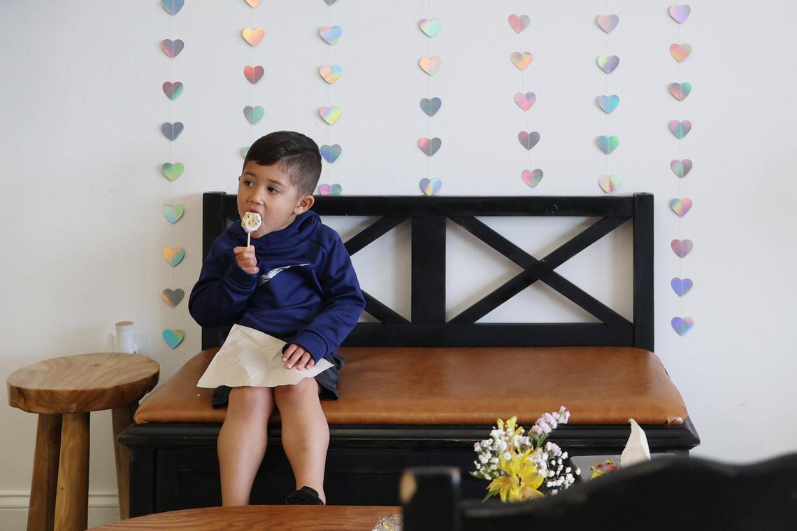 Nolan Longaker, 2, from Bonaire, Georgia, eats a cake pop inside of Little Light Coffee Co. in Warner Robins.
