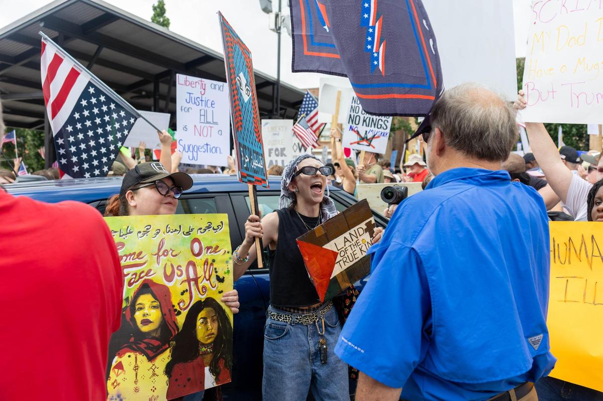 Lee McCombs, 24, from Macon, Georgia, argues with counter protester John Ricketson (right) during a No Kings protest on Saturday, June 14, 2025, in downtown Macon, Georgia. There was a small group of counter protesters supporting President Trump, sparking arguments on the edge of the gathering.