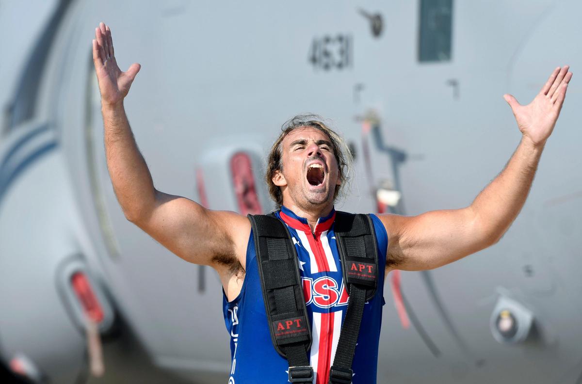 Mark Kirsch belts out a scream after pulling a C-130 during his “Man vs. Impossible” appearance at the Thunder over Georgia Air Show at Robins Air Force Base on Saturday. He performs again Sunday at the air show.