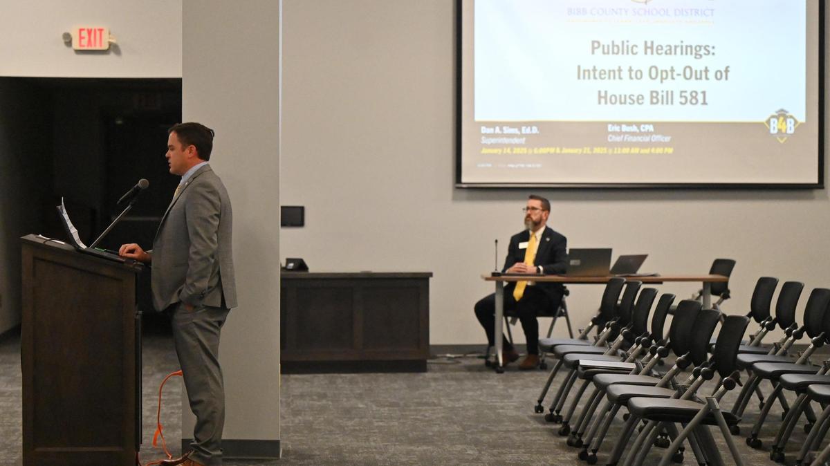 Bibb County School District chief financial officer Eric Bush (left) gives a presentation before the first of three public hearings for the county to opt out of Georgia House Bill 881 on Tuesday, Jan. 14, 2025, at the Bibb County Professional Learning Center in Macon, Georgia. The Bibb County school board voted on Feb. 5 to opt out of House Bill 581, a homestead exemption piece of legislation that would have given tax relief to homeowners, but could result in a drop in school board revenue.
