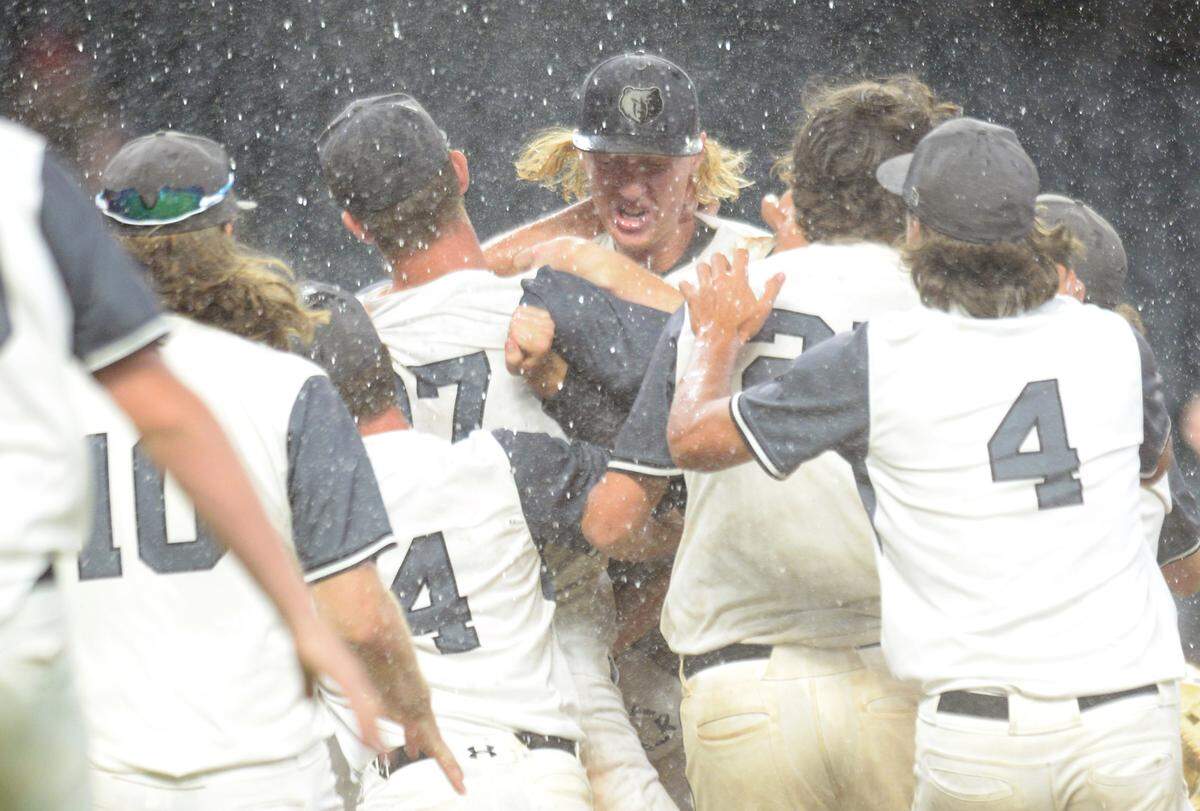Houston County players celebrate their GHSA 6A Championship series win over Lassiter Wednesday in Atlanta.