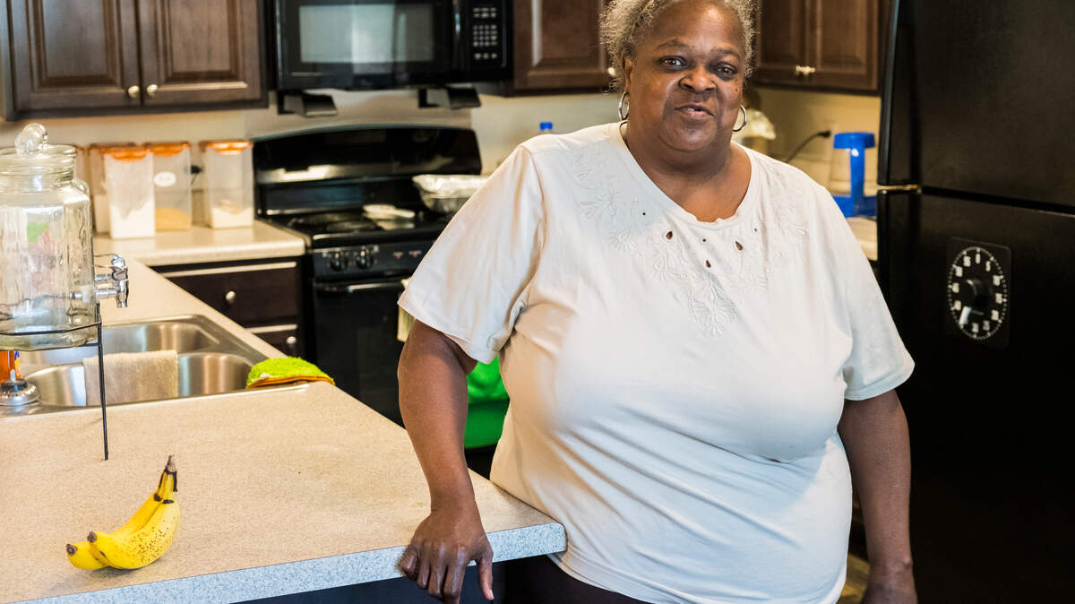 Annie Johnson in the kitchen of her new apartment in Tindall Senior Towers in Macon.