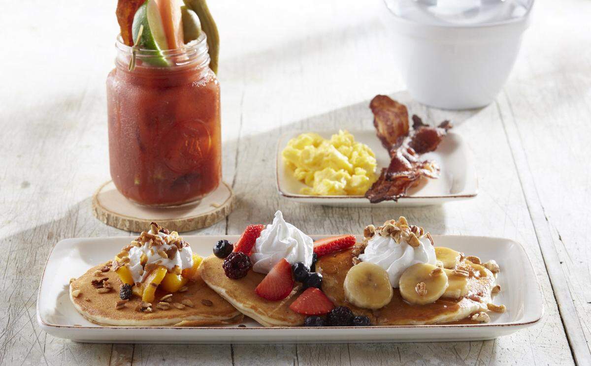 A pancake platter and a Blood Mary at Another Broken Egg Cafe.