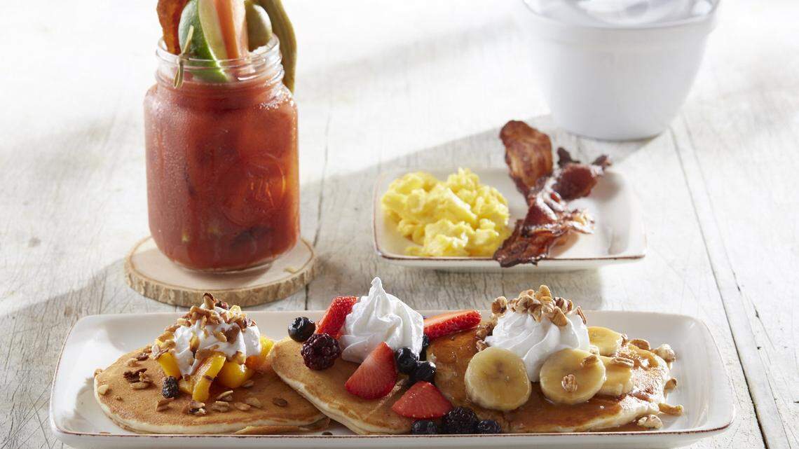 A pancake platter and a Blood Mary at Another Broken Egg Cafe.