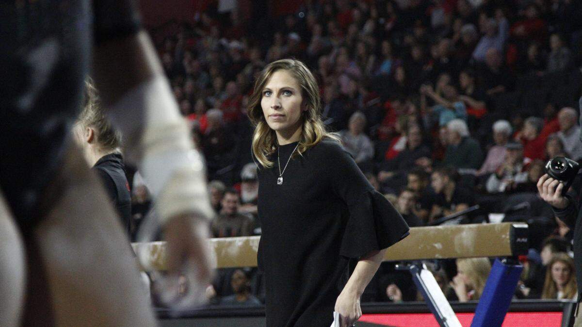 Georgia Gym Dogs head coach Courtney Kupets Carter leads her team against Oklahoma.