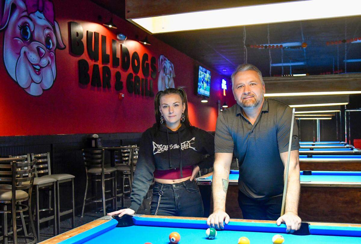 Owner John Boutwell and his daughter Sarah at Bulldogs Bar and Grill at 3750 Bloomfield Village Drive in Macon.